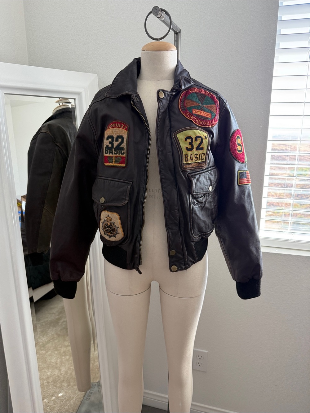 Vintage Black Leather Bomber Jacket with Patch Details